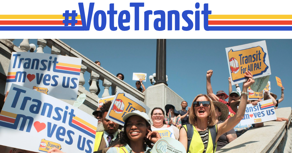 A diverse crowd of transit riders at the PA State Capitol building, cheering and holding "Transit for All PA" signs